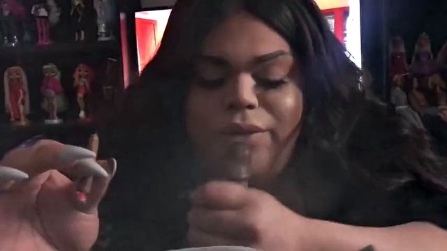 Fat black trans woman sucks a black cock and makes her cum