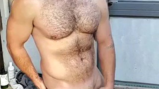 Muscle jock cums after sexy oil shower, slow mo hands free cum