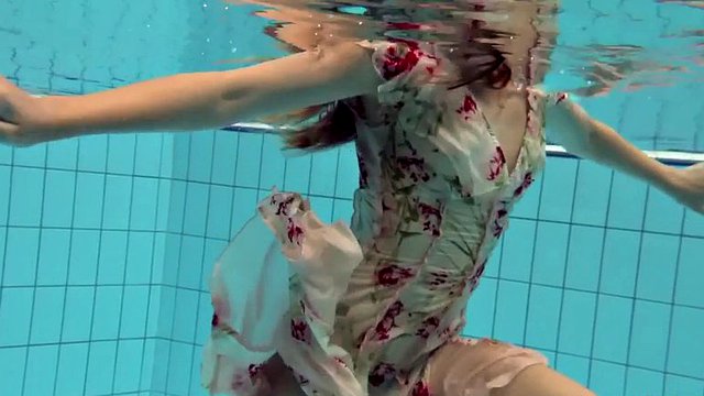 lucy takes the dress off showing her hairy pussy and titties underwater