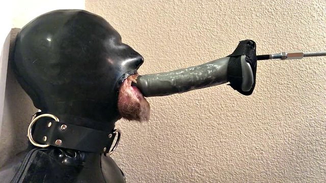 Rubber pig throat fucked by a machine