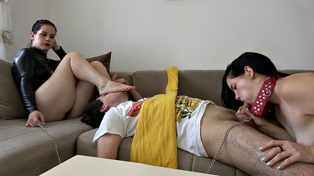 Anna's double domination, she orders the slave to kiss her feet and the slave to give her a blowjob