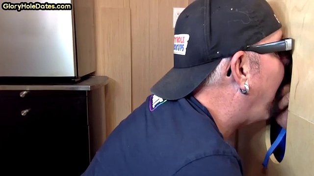 Gloryhole gay enjoys jerking a big cock while sucking it