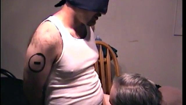 Blindfolded dude receives a blowjob from a mature twink