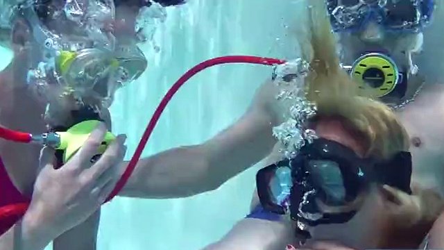 Two hot girls suck a big cock in the pool
