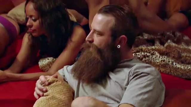 couple enjoys the party bus with cocktails and naked babes
