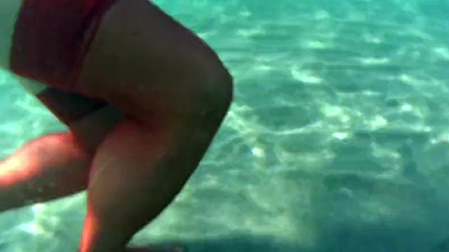 red stocking in the sea on a public beach