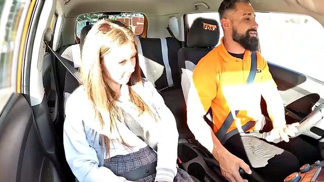 Doggystyled driving student enjoys class