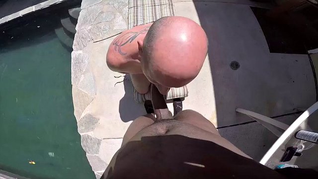 Horny gagging gay guy sucks a cock by the pool