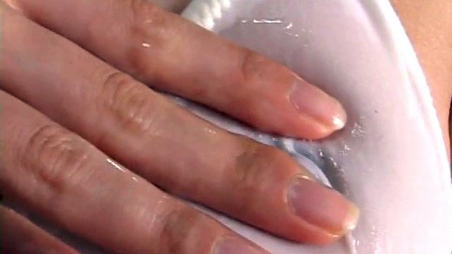 Japanese bitch covers herself with sticky jizz