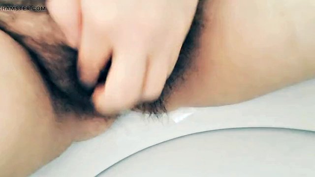 MILF stepmom peeing hairy pussy in bathroom