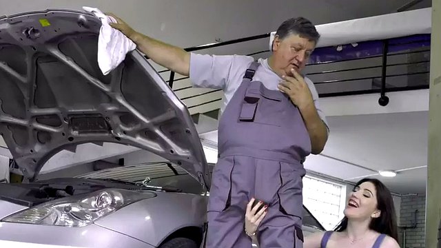 Old pervert fucks a babe with medium tits in a car repair shop