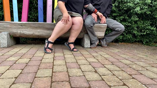 Mother-in-law masturbates her stepson's cock in a public park