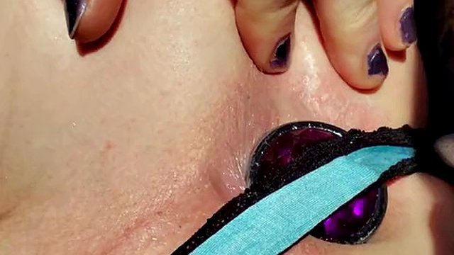 Krystall Cox in a chastity cage using a pussy and a vibrator to make a beautiful rosebud